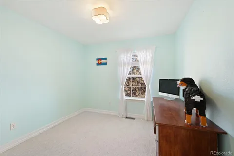 a room with a bed and a chandelier