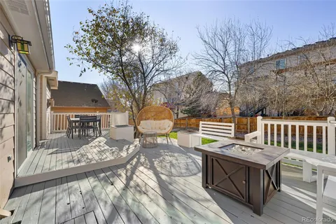 a view of a chairs and tables on the deck