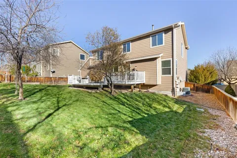 a front view of house with yard and outdoor seating
