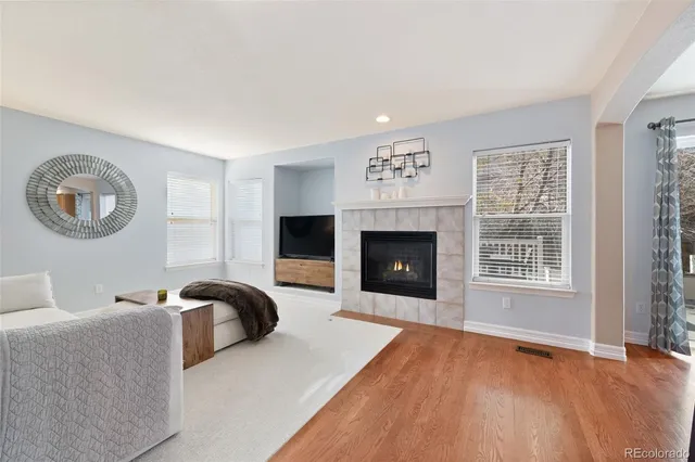 a bedroom with a bed and a fireplace