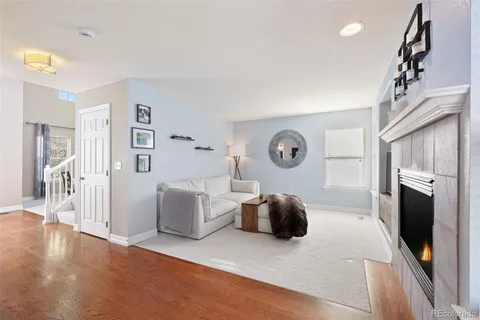 a bedroom with furniture and a fireplace