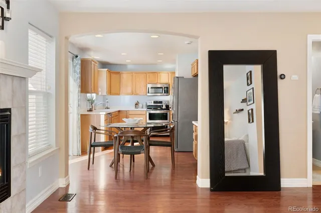 a view of a dining room with furniture and wooden floor