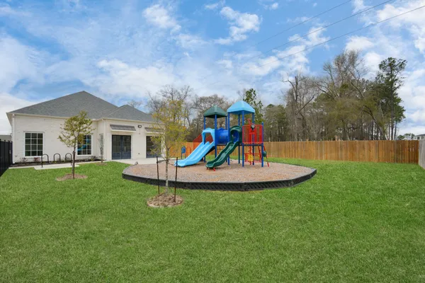 a childrens park with lots of swings and slides