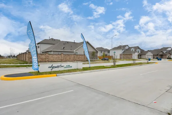 a view of swimming pool with outdoor seating and yard in back