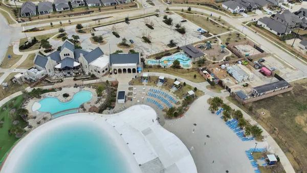 an aerial view of residential houses with outdoor space