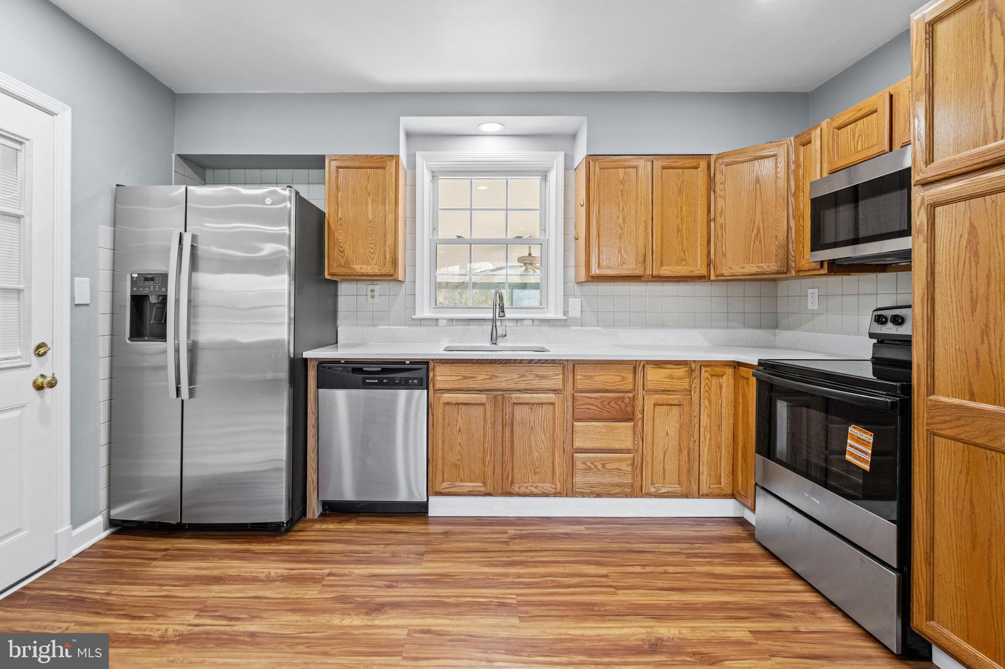 1413 Glendale Road Baltimore, MD 21239 - Photo 5 of 26 Updated Kitchen with Oak Cabinets, Granite Counter