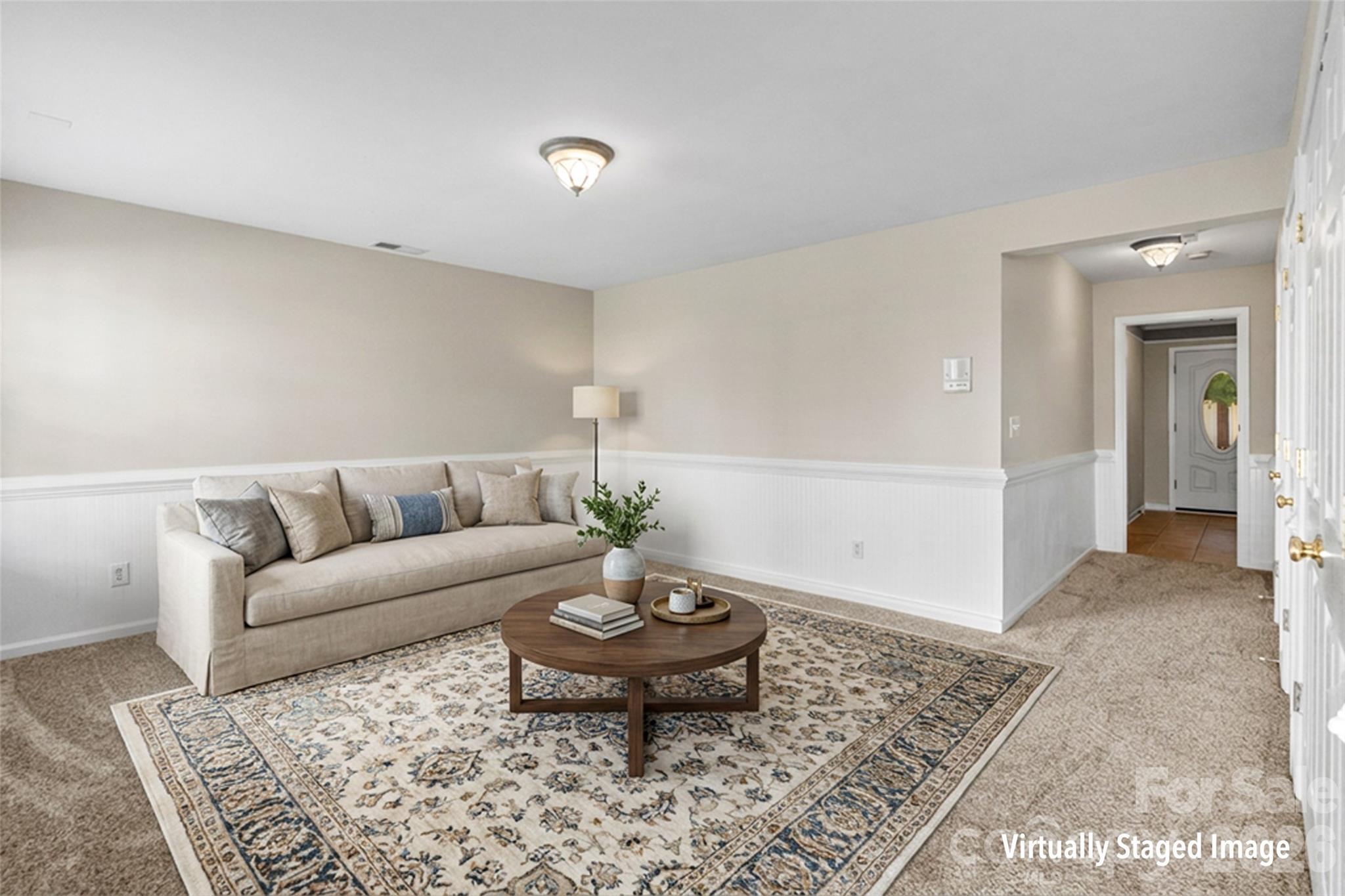 104 Rock Ridge Lane Mount Holly, NC 28120 - Photo 9 of 48 a living room with a couch and a coffee table