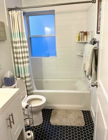 a bathroom with a sink a toilet and a bathtub