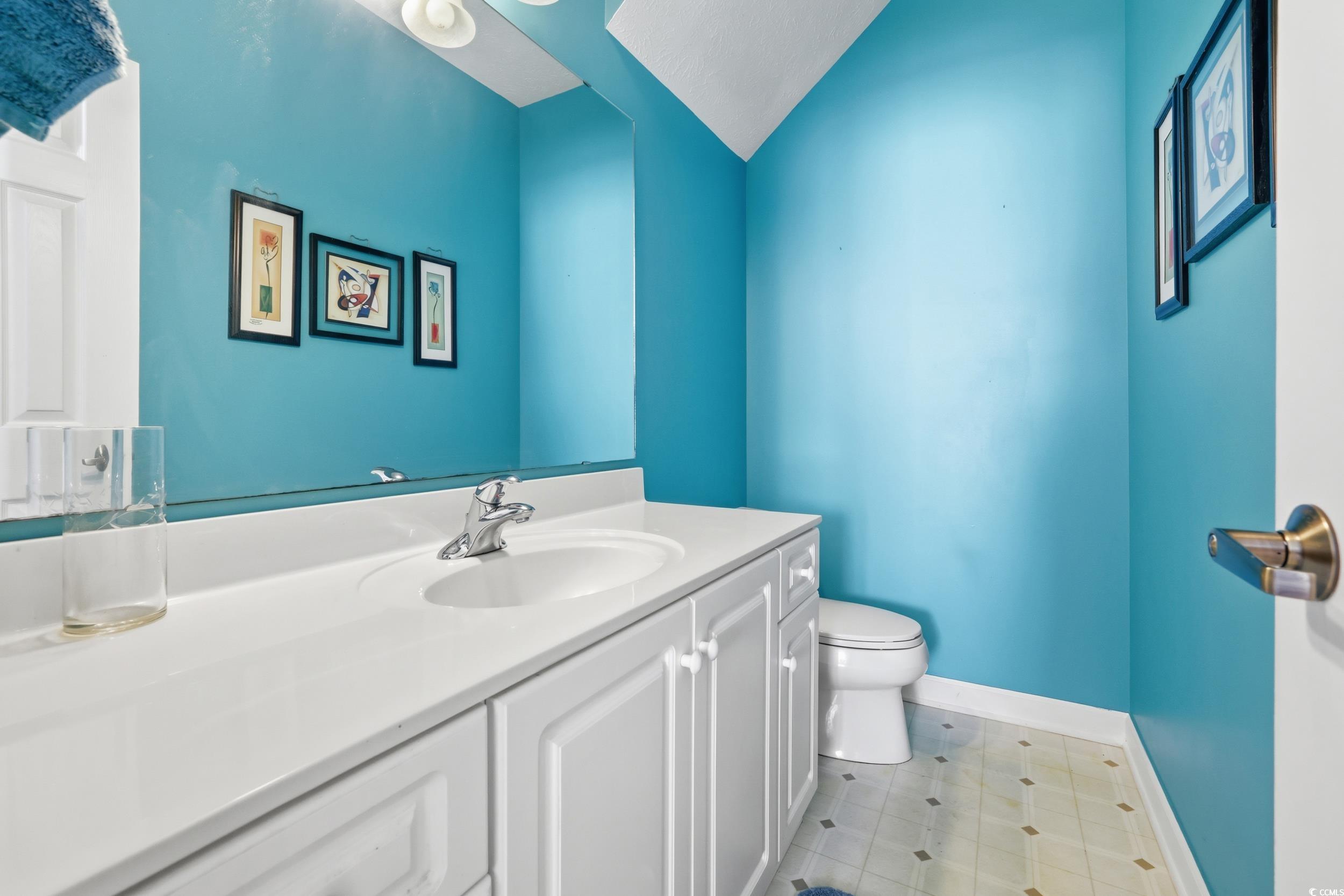 309 Meadowside Drive Little River, SC 29566 - Photo 12 of 40 Bathroom featuring vanity and toilet