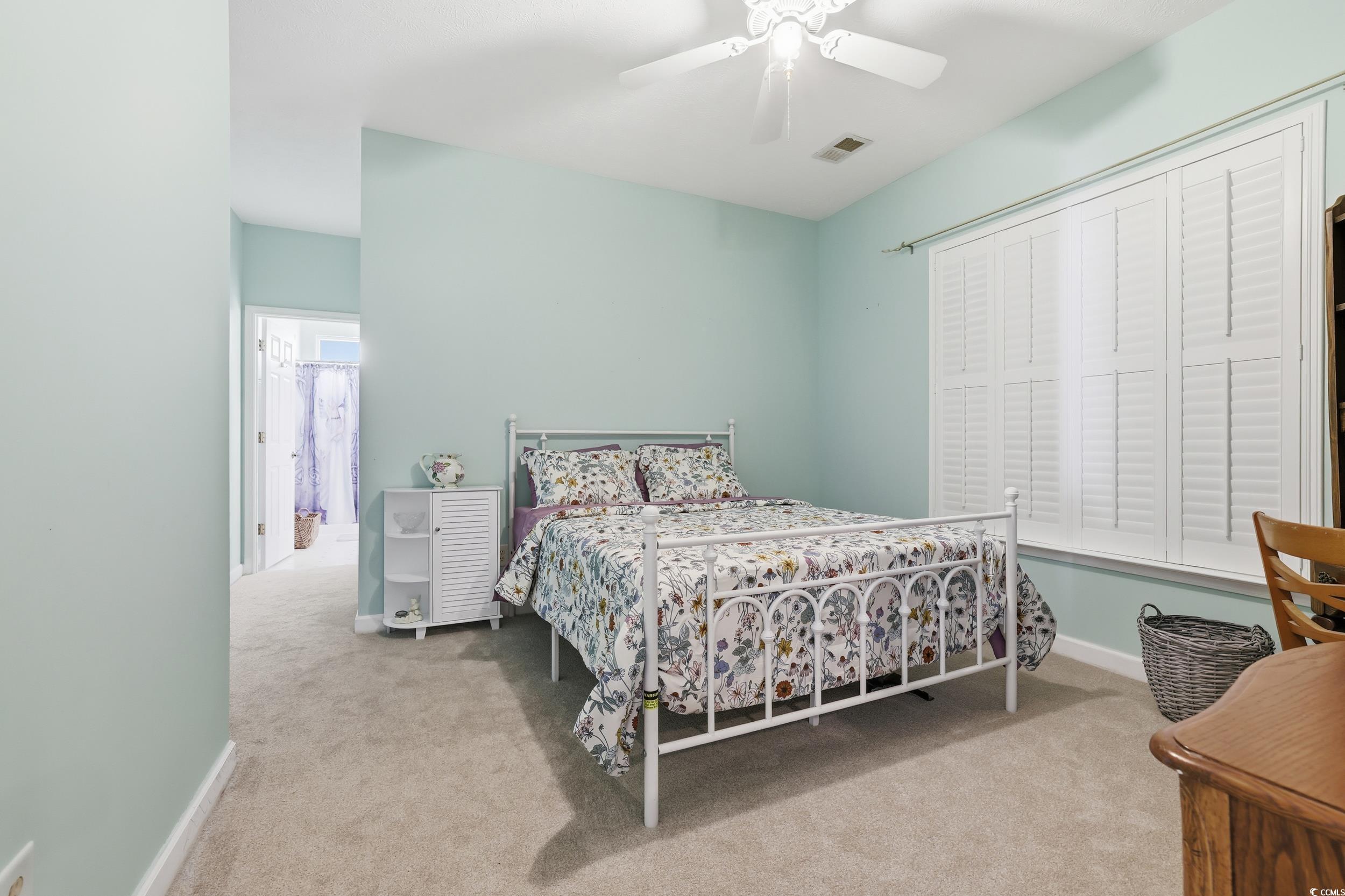 309 Meadowside Drive Little River, SC 29566 - Photo 15 of 40 Bedroom featuring light carpet and a ceiling fan