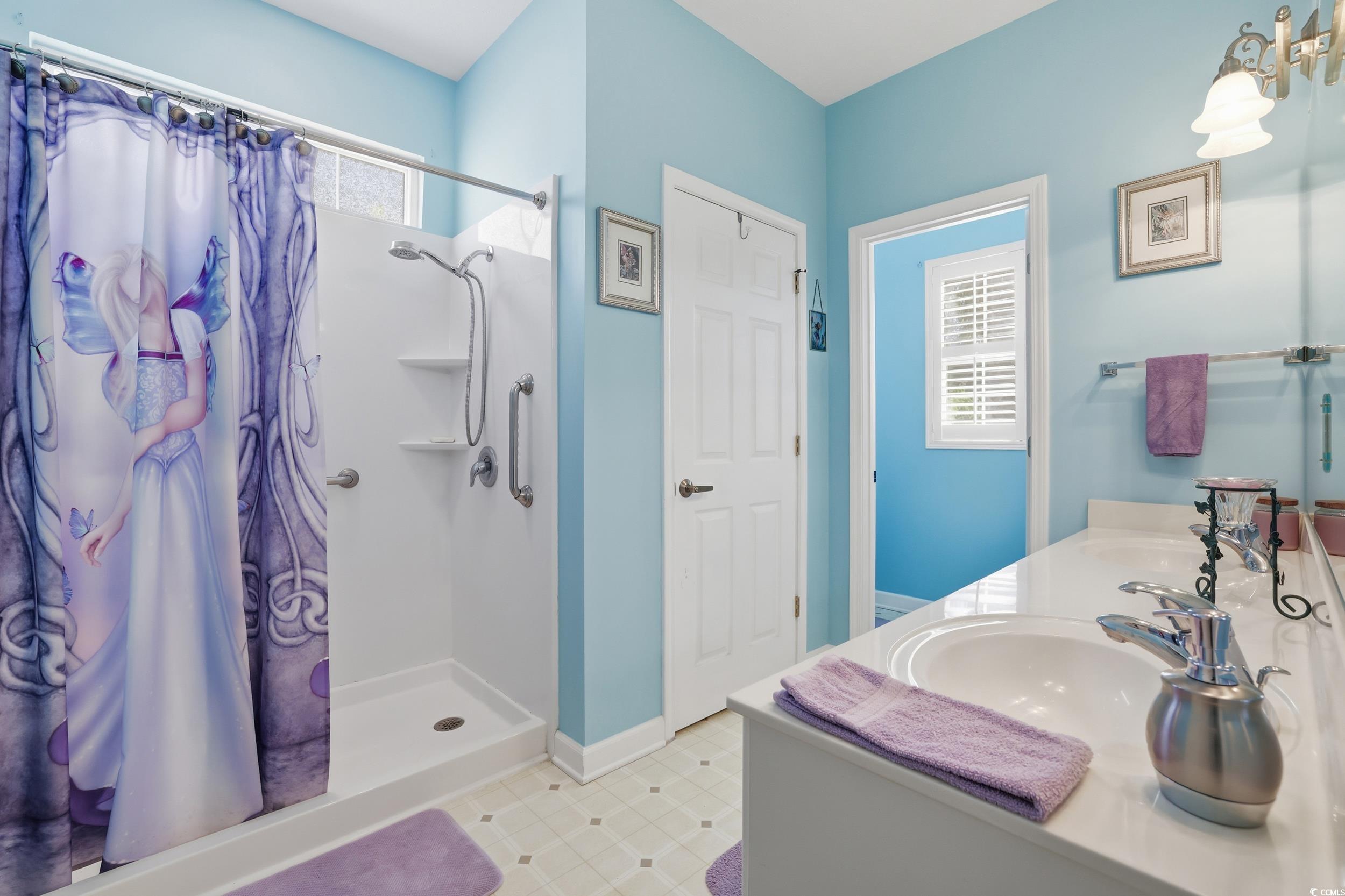 309 Meadowside Drive Little River, SC 29566 - Photo 17 of 40 Full bathroom featuring a shower stall and double vanity