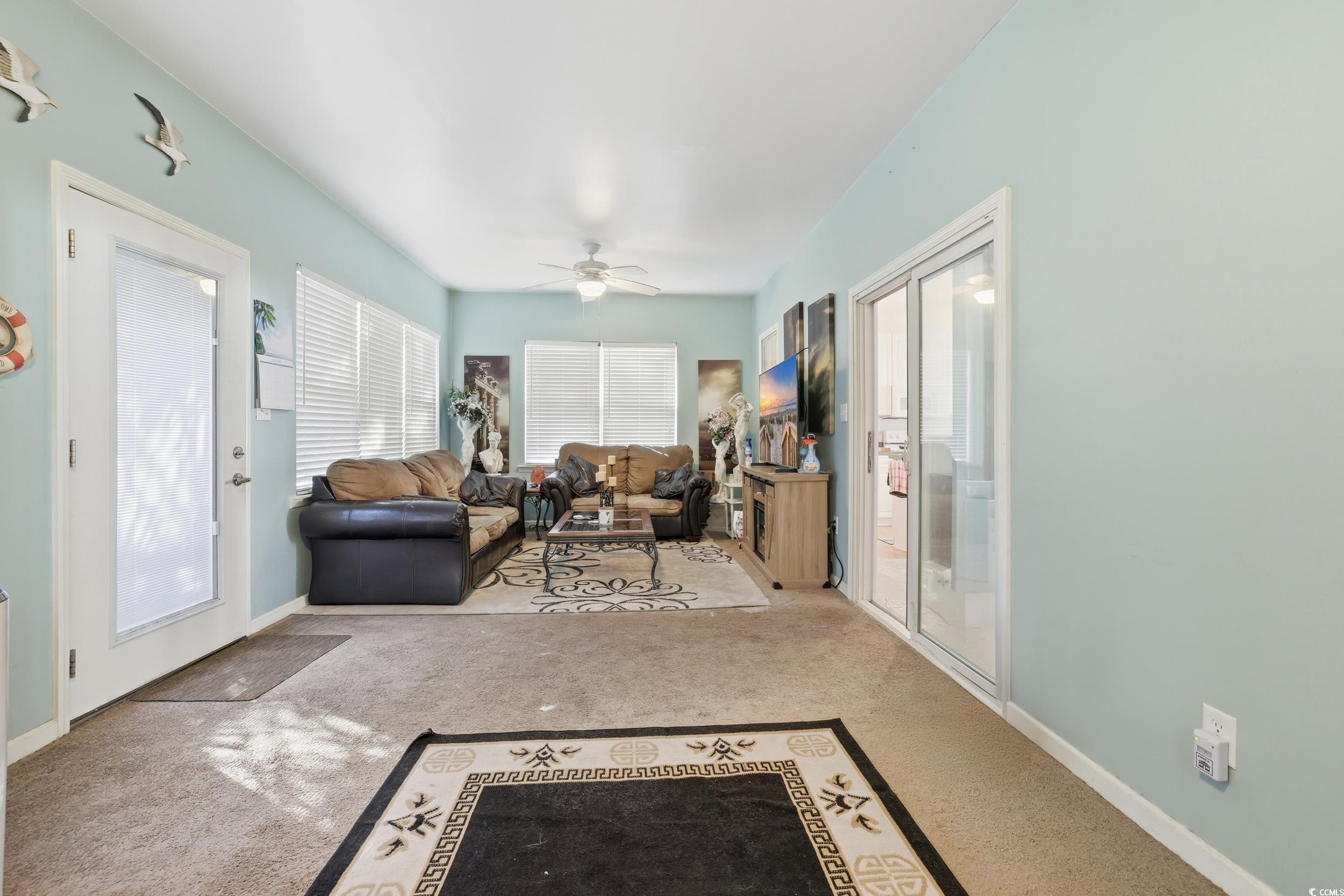 309 Meadowside Drive Little River, SC 29566 - Photo 19 of 40 Living area featuring a ceiling fan and carpet flooring