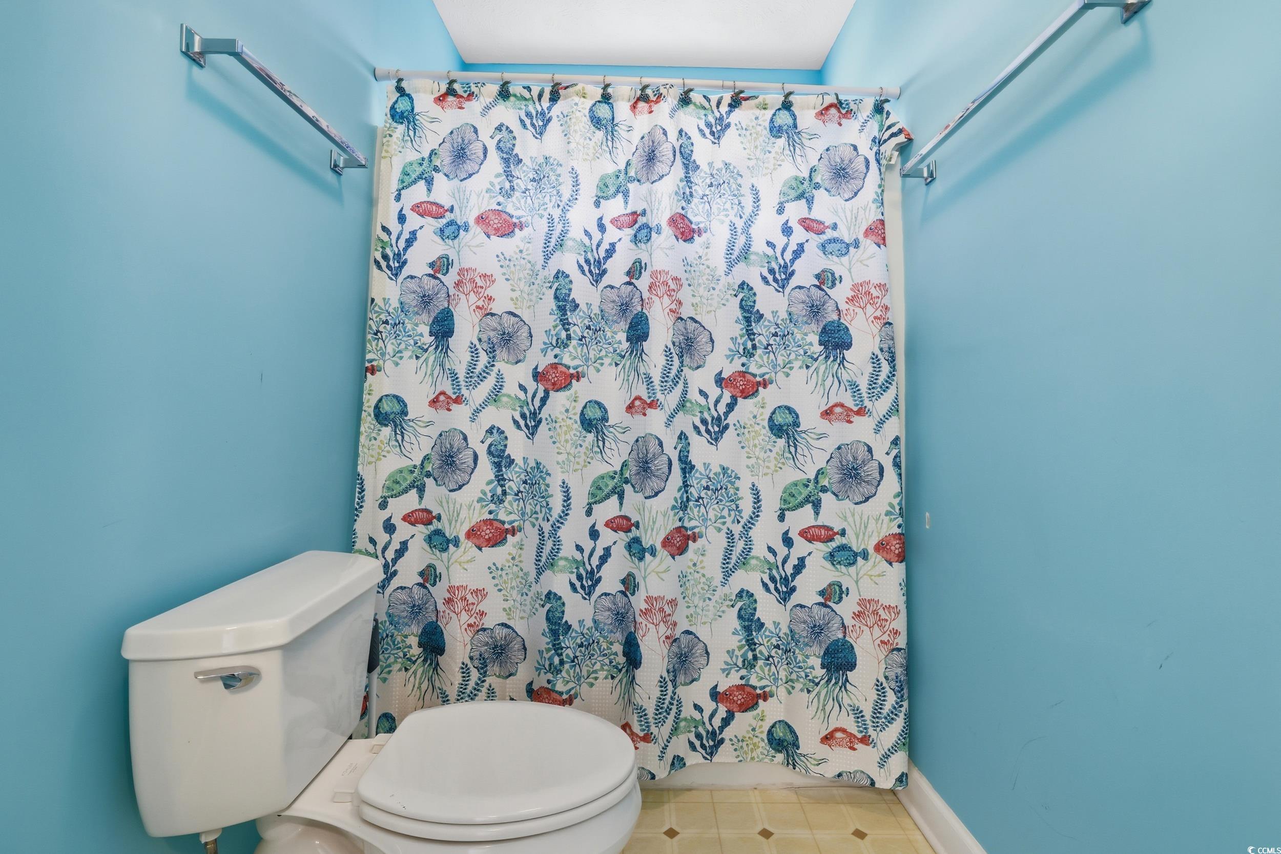 309 Meadowside Drive Little River, SC 29566 - Photo 25 of 40 Full bathroom featuring a shower with shower curtain and tile patterned floors