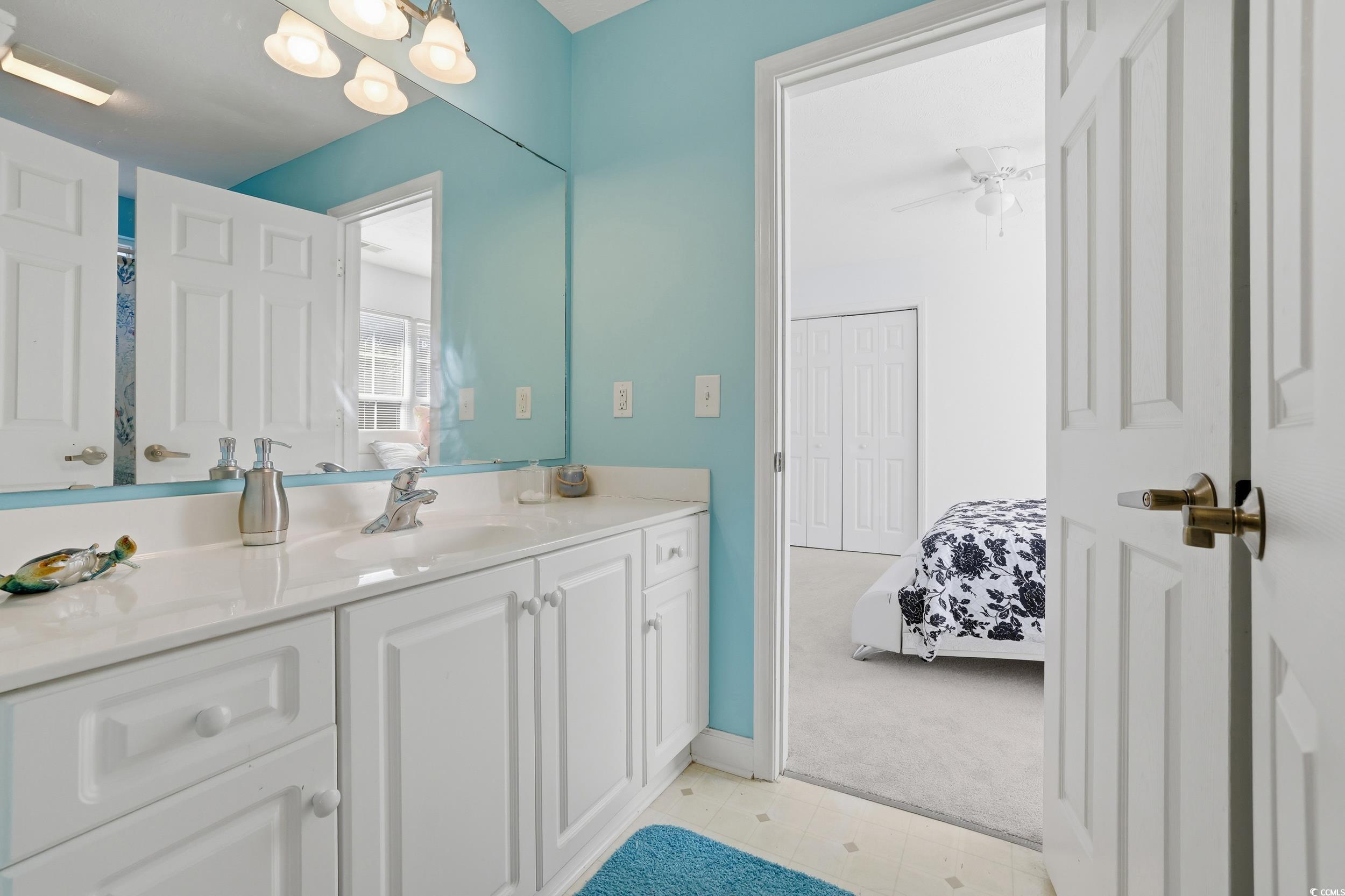 309 Meadowside Drive Little River, SC 29566 - Photo 26 of 40 Full bath featuring vanity, light carpet, a chandelier, ensuite bath, and a ceiling fan