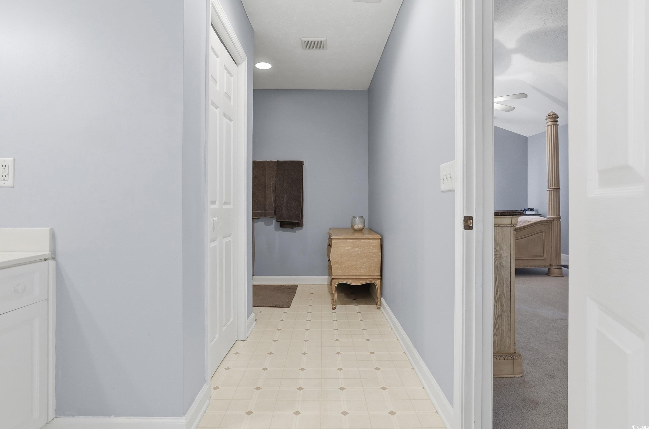 309 Meadowside Drive Little River, SC 29566 - Photo 31 of 40 Hallway featuring baseboards and light floors