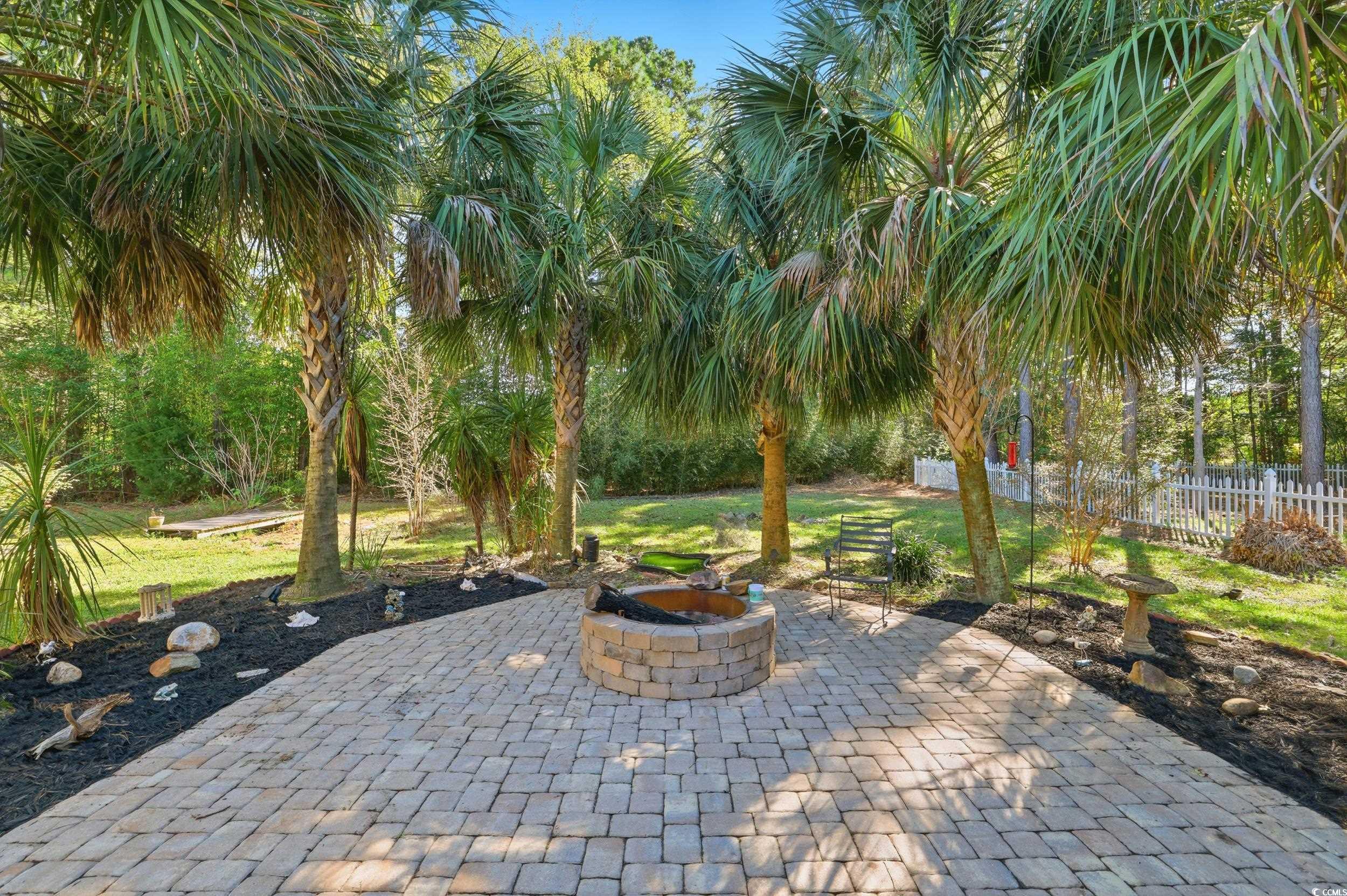 309 Meadowside Drive Little River, SC 29566 - Photo 32 of 40 View of patio with an outdoor fire pit