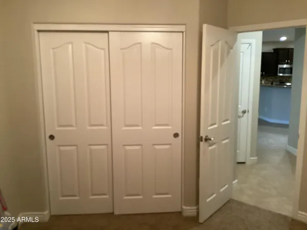 a bathroom with a granite countertop toilet and a shower curtain