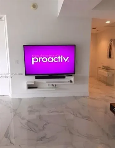 a bedroom with two beds and a large window