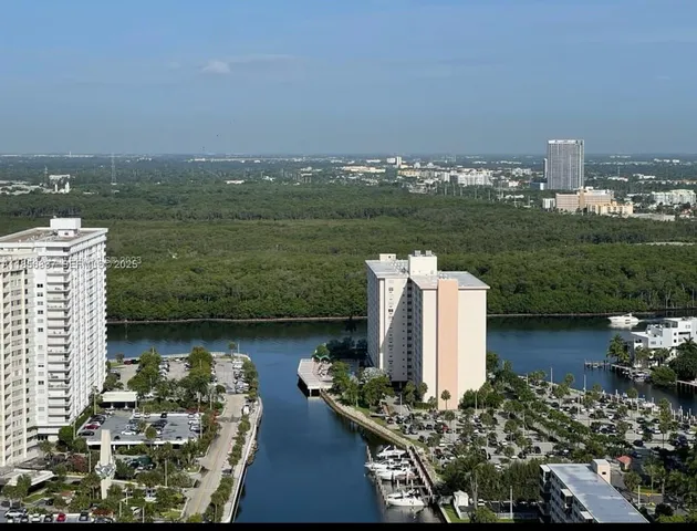 a view of a city and a lake