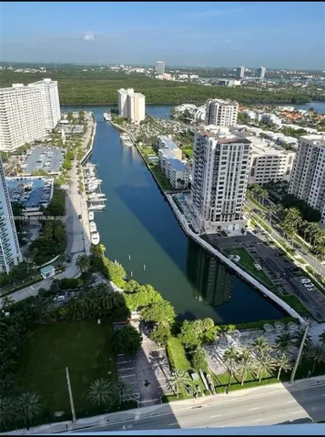 a view of a city with a lake