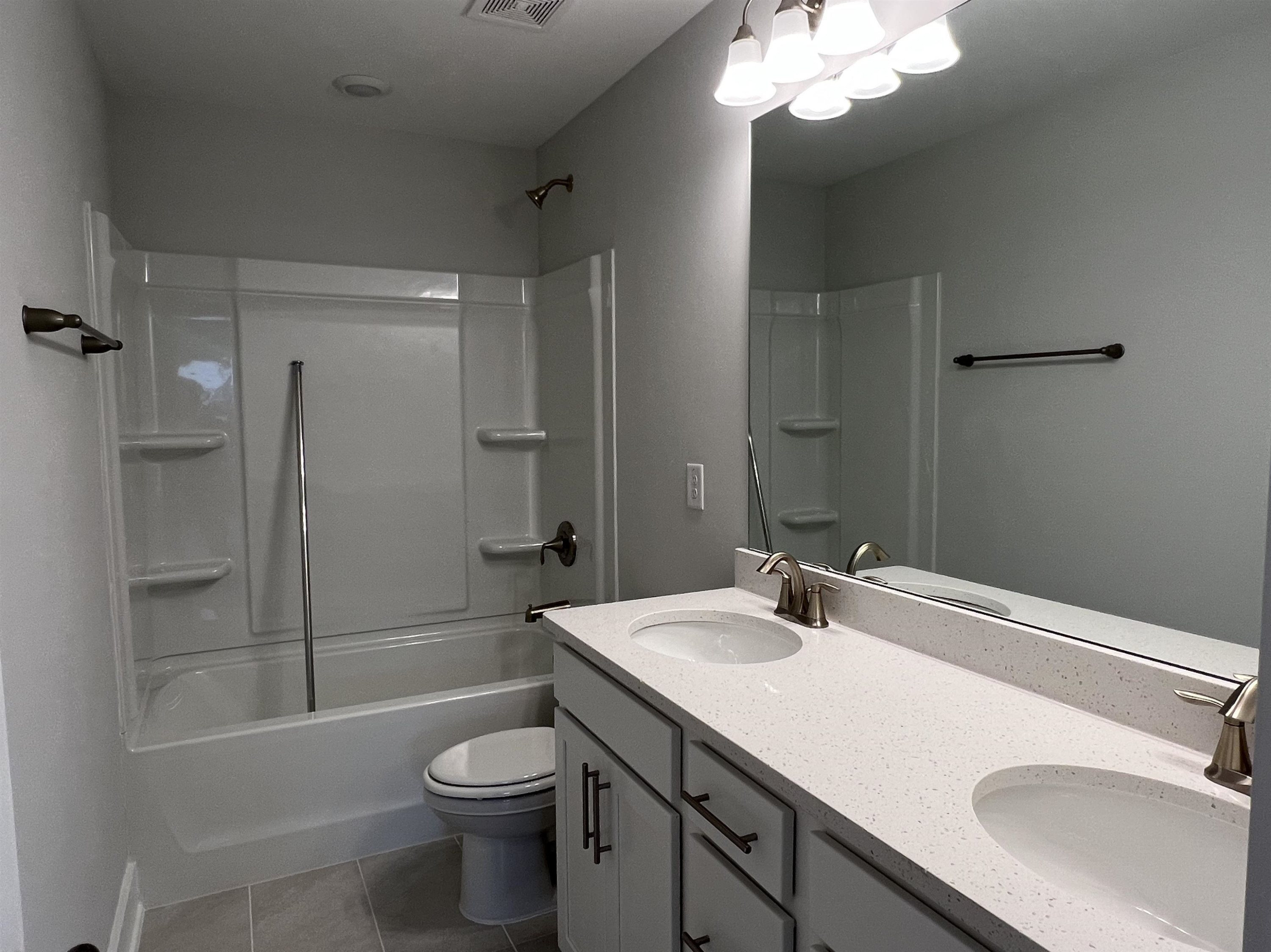 2209 Seneca Road Raleigh, NC 27604 - Photo 17 of 21 a bathroom with a sink a toilet and shower