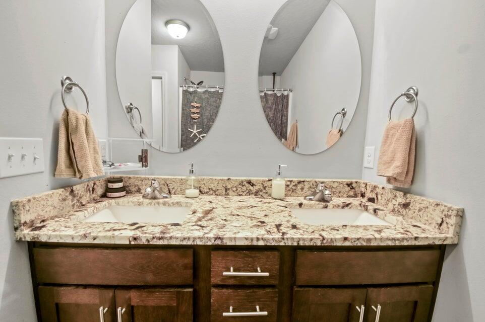 300 Cassady Lane Crestview, FL 32539 - Photo 16 of 25 a bathroom with a granite countertop sink and a mirror