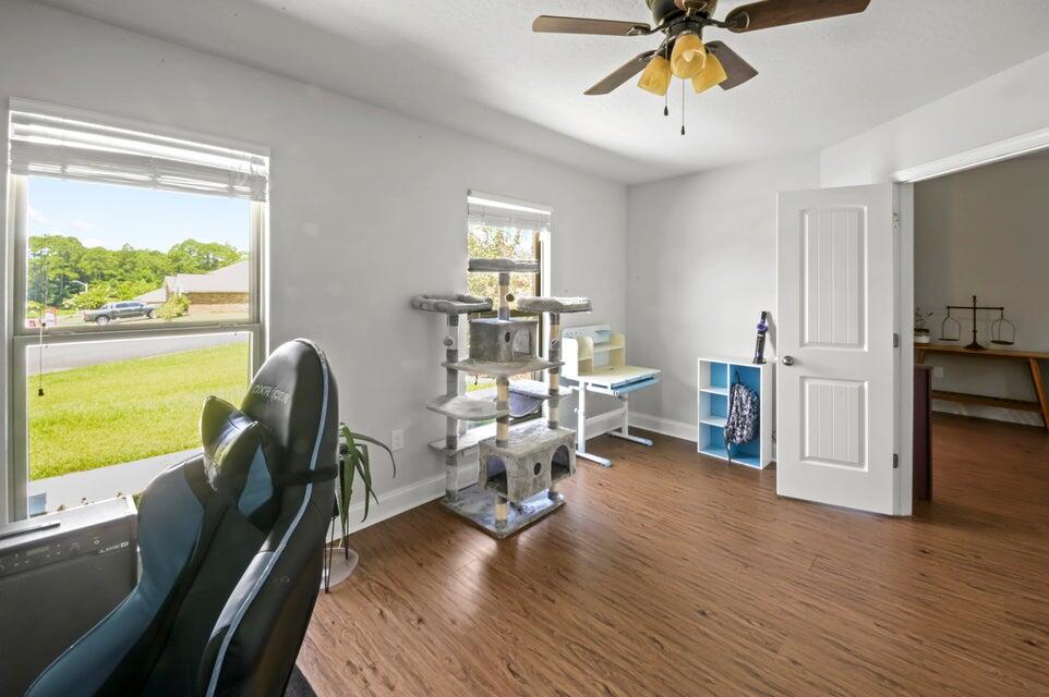 300 Cassady Lane Crestview, FL 32539 - Photo 18 of 25 a view of a livingroom with furniture hardwood floor and a window