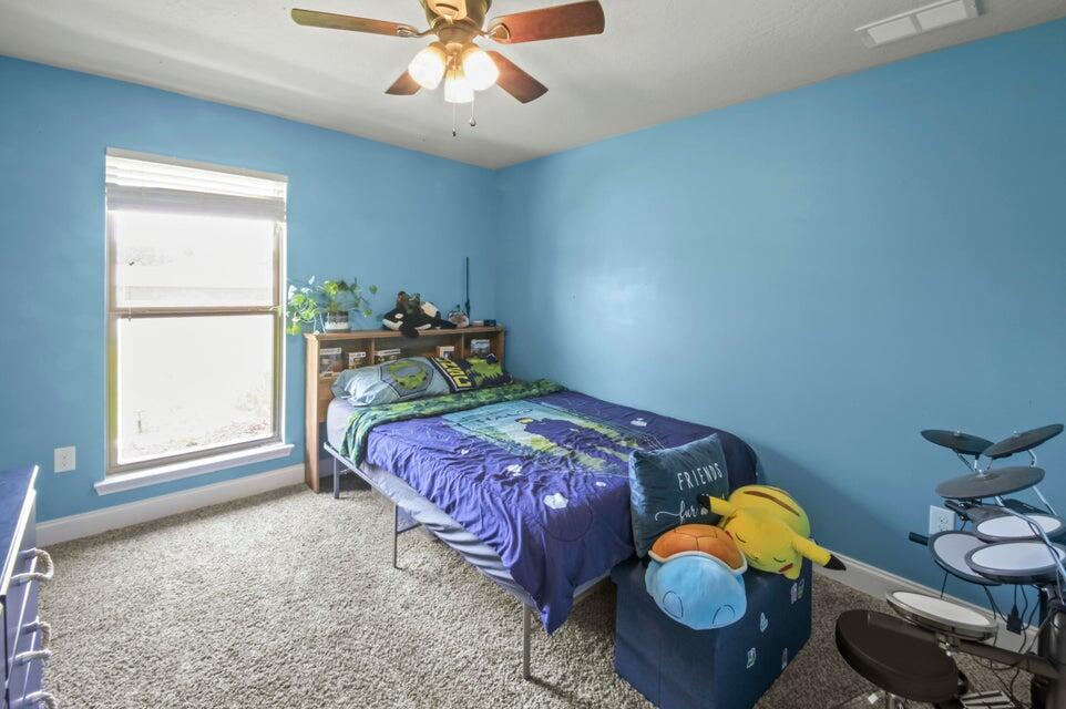 300 Cassady Lane Crestview, FL 32539 - Photo 19 of 25 a bedroom with a bed and window