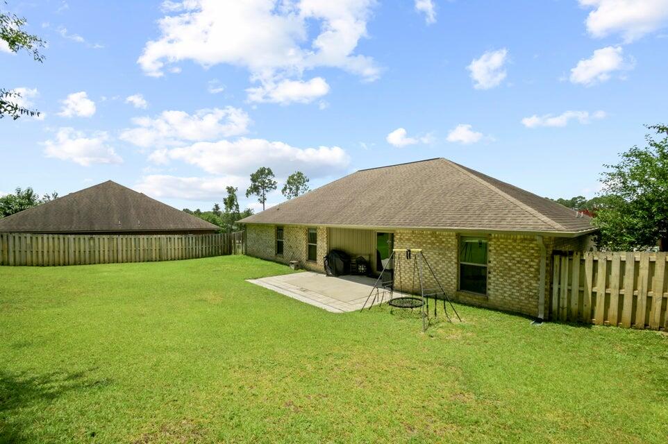 300 Cassady Lane Crestview, FL 32539 - Photo 24 of 25 a view of a house with backyard and sitting area