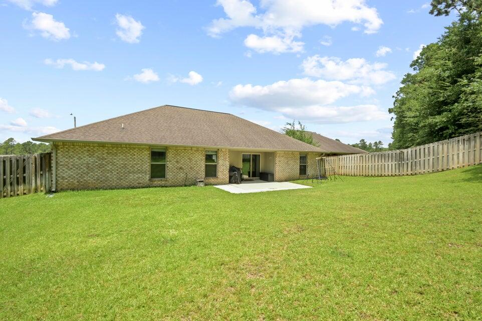 300 Cassady Lane Crestview, FL 32539 - Photo 25 of 25 a front view of a house with garden
