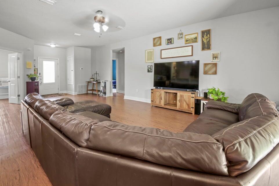 300 Cassady Lane Crestview, FL 32539 - Photo 7 of 25 a living room with furniture and a flat screen tv