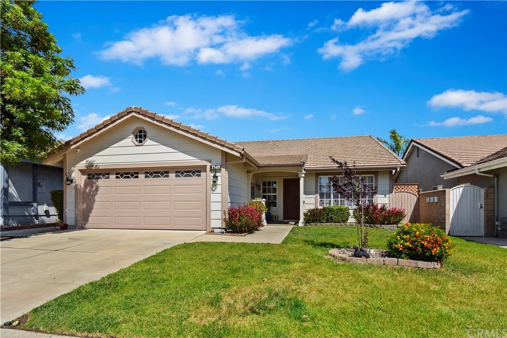 7349 Springmill Place Rancho Cucamonga, CA 91730 - Photo 1 of 1 a front view of house with yard