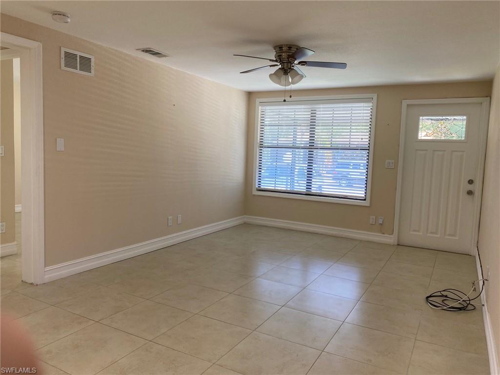 5389 Treetops Drive Naples, FL 34113 - Photo 2 of 8 Entrance foyer featuring ceiling fan and light tile patterned flooring