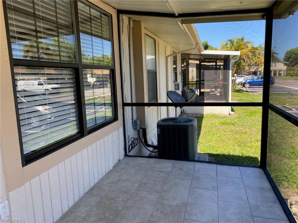 5389 Treetops Drive Naples, FL 34113 - Photo 8 of 8 View of unfurnished sunroom
