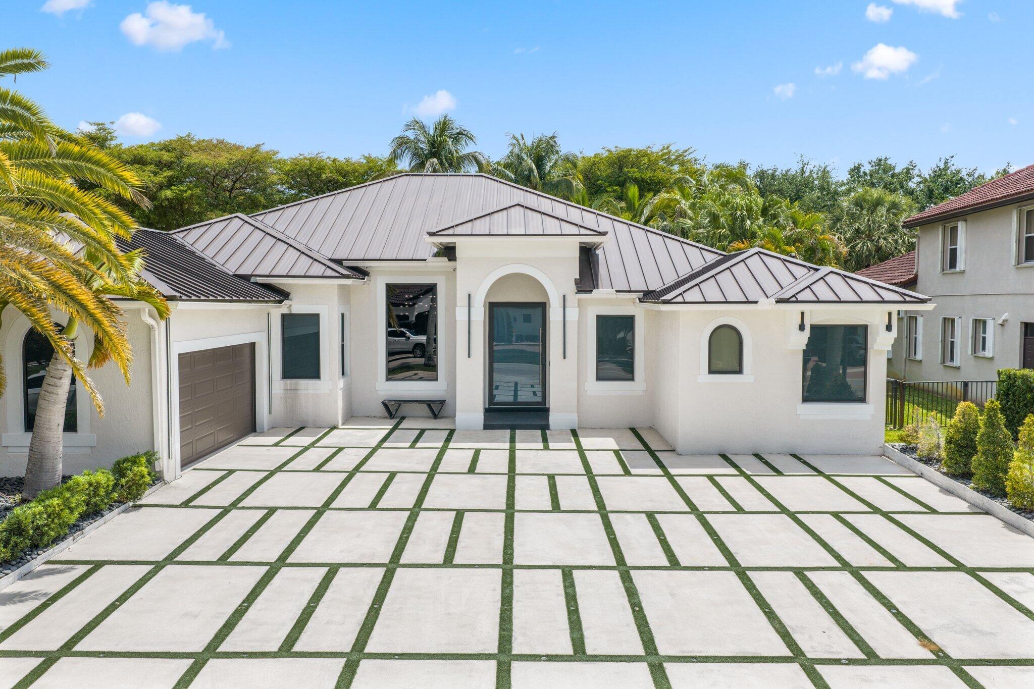 4265 Southwest 185th Avenue Miramar, FL 33029 - Photo 1 of 64 a house view with a outdoor space