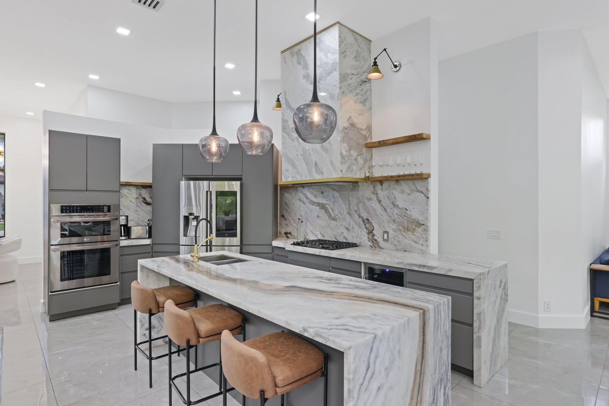 4265 Southwest 185th Avenue Miramar, FL 33029 - Photo 20 of 64 a kitchen with a table and chairs in it
