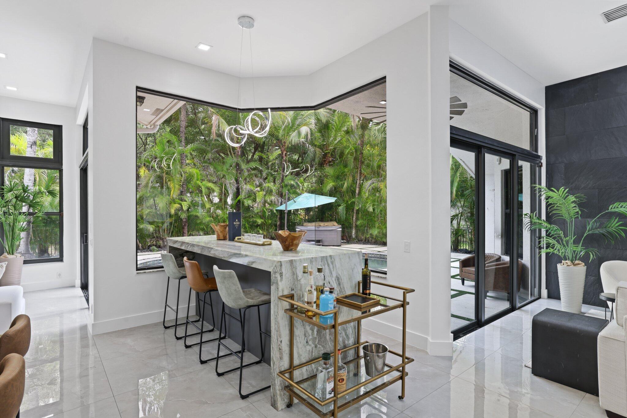 4265 Southwest 185th Avenue Miramar, FL 33029 - Photo 25 of 64 a view of a dining room with furniture window and outside view