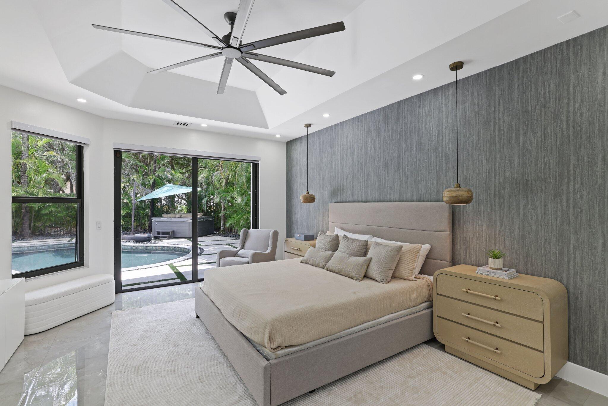 4265 Southwest 185th Avenue Miramar, FL 33029 - Photo 34 of 64 a bedroom with a bed and a large window