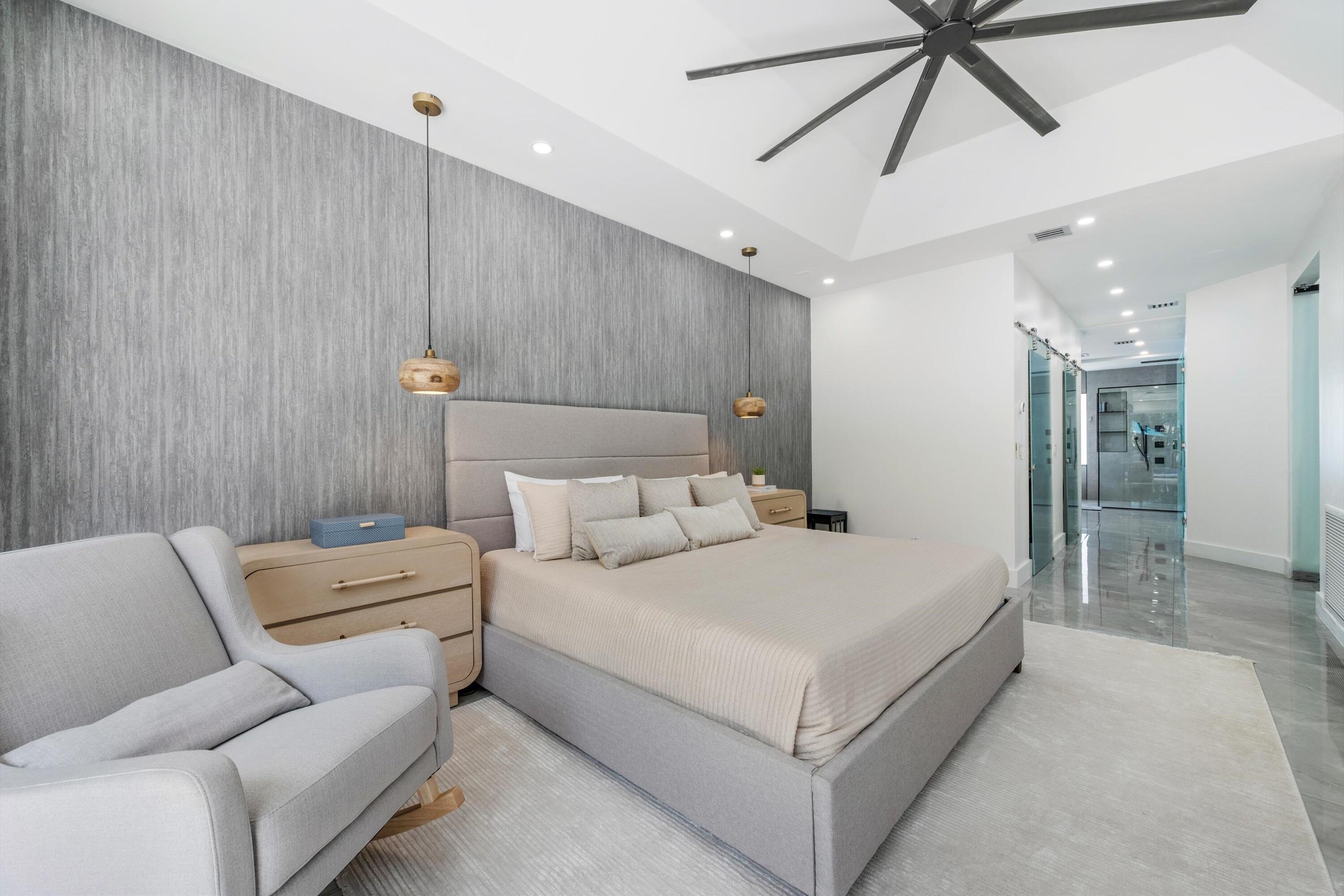 4265 Southwest 185th Avenue Miramar, FL 33029 - Photo 36 of 64 a bedroom with a bed and ceiling fan