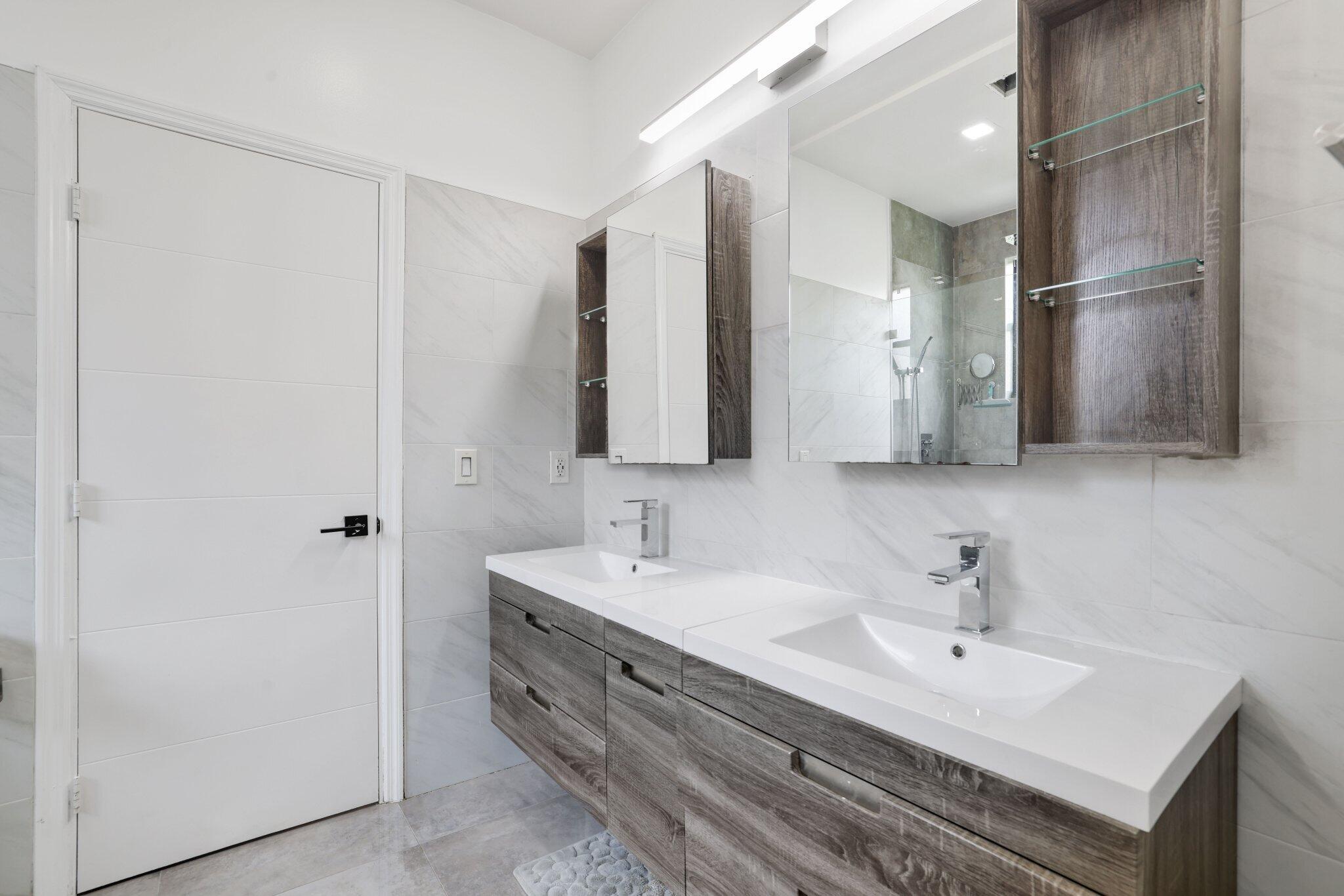 4265 Southwest 185th Avenue Miramar, FL 33029 - Photo 47 of 64 a bathroom with a sink and a mirror