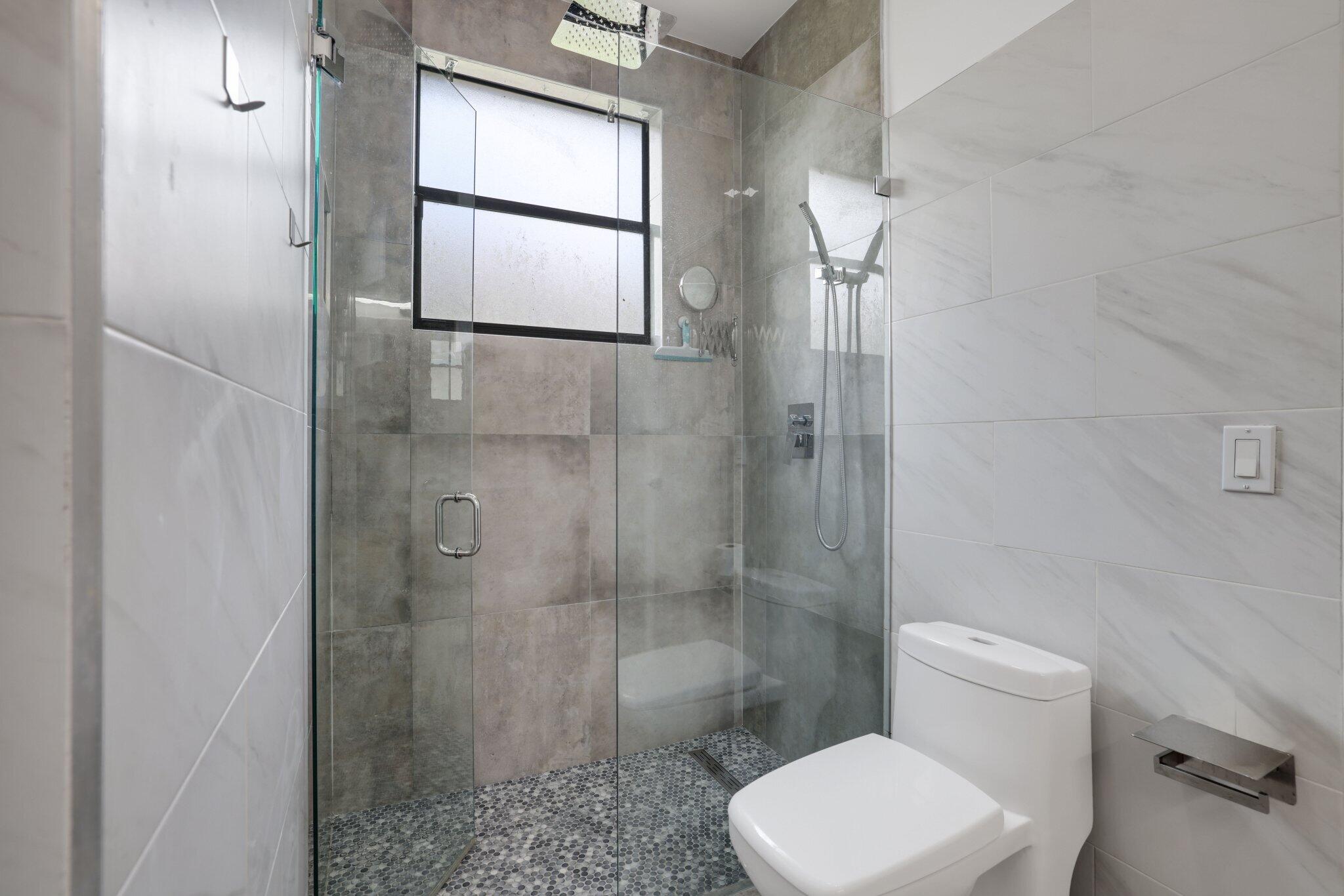 4265 Southwest 185th Avenue Miramar, FL 33029 - Photo 48 of 64 a bathroom with a toilet and a shower