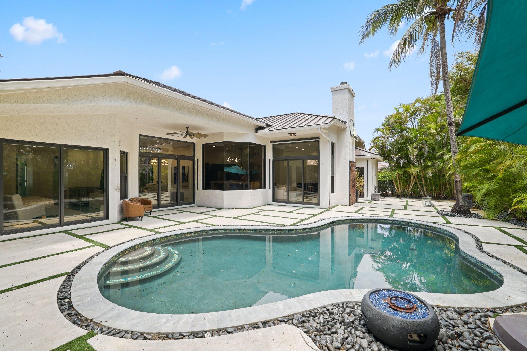4265 Southwest 185th Avenue Miramar, FL 33029 - Photo 56 of 64 a view of a house with pool and sitting area