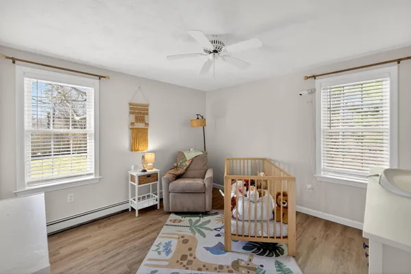 a bedroom with furniture and a window