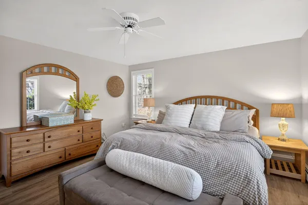 a bedroom with a large bed and a window