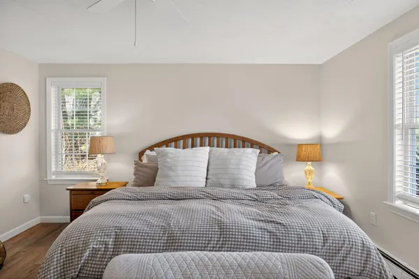 a bed room with a bed and a window