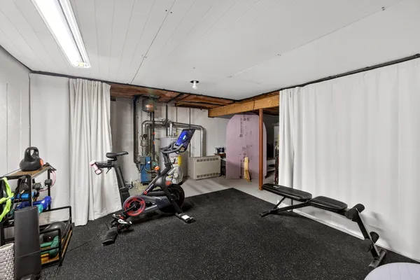 a view of empty room with wooden ceiling