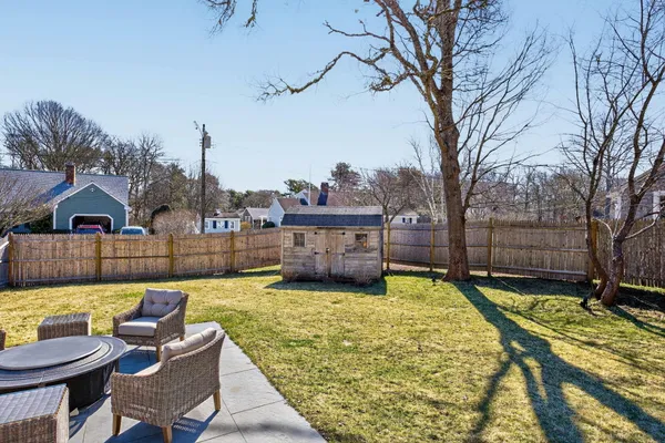 a view of a house with swimming pool and sitting area