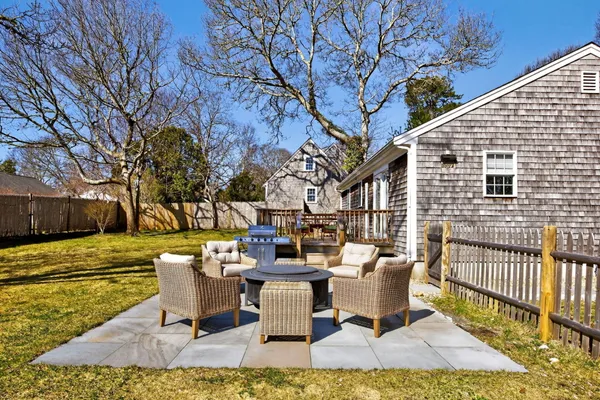 a view of a deck with furniture