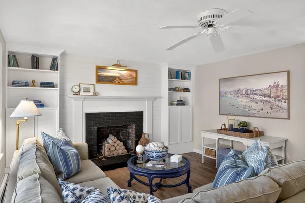 a living room with furniture and a fireplace