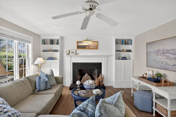 a living room with furniture and a fireplace